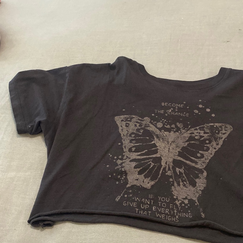 Black, flowy, cropped shirt.